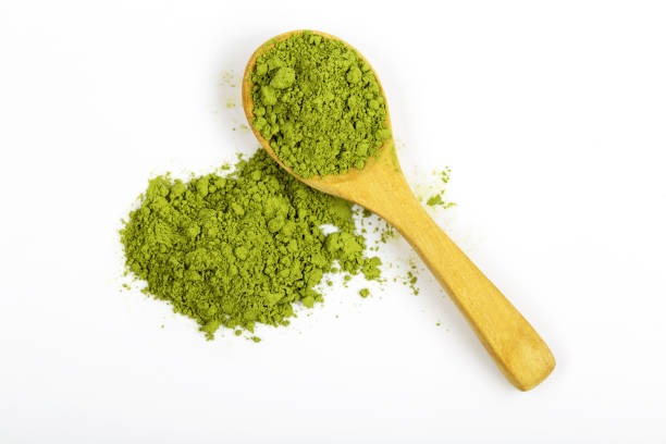 istock Top view green matcha tea powder isolated on white background 1301777127