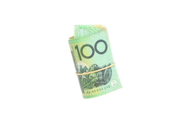 istock group of 100 dollar Australian notes roll on white background 1301777501
