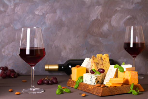 istock Glasses and bottle of red wine with cheese and nuts 1301778233
