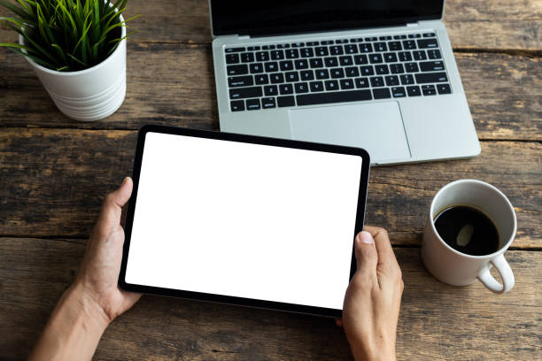 istock Mockup image tablet, man hand holding tablet pc with blank white screen 1301778373