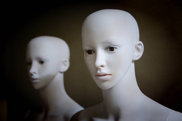 istock White scary mannequins stand and look at each other with their eyes 1301779689