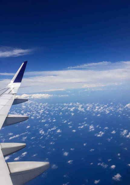 istock view of blue sky and airplane window 1301780289