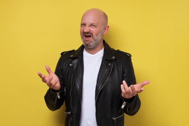 istock Displeased man with beard gesturing actively, frowning face while arguing 1301780496