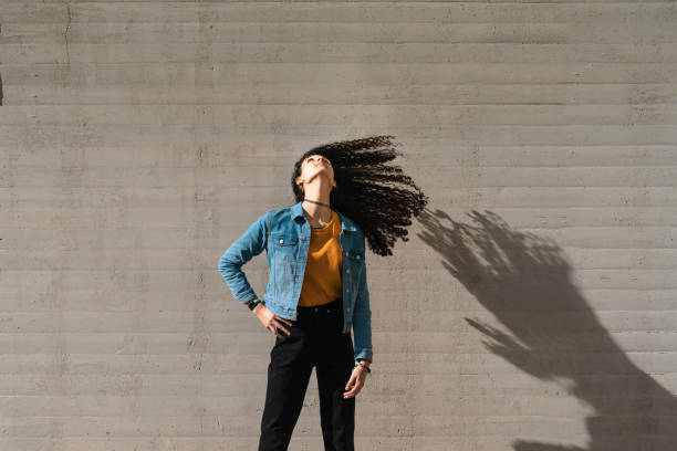 istock Transgender woman shaking her hair while dancing 1301781480