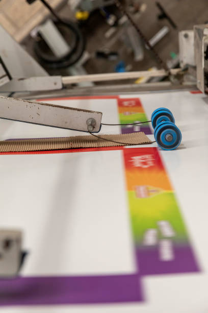 istock Closeup of an offset printing machine during production. 1301781693