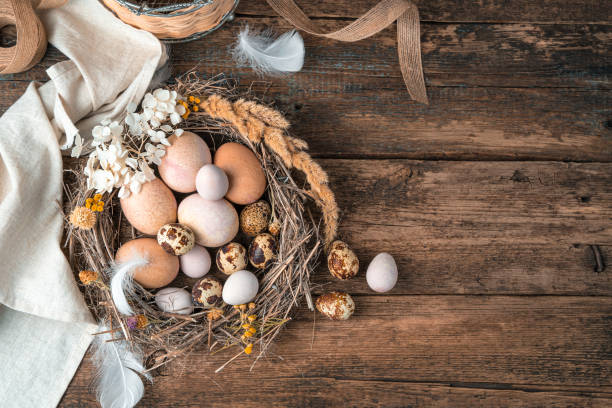 istock Happy Easter, festive background with eggs in a nest on a wooden background 1301783068