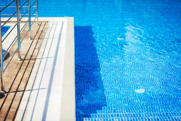 istock Part of the Pool with turquoise Water, Background. 1301786210