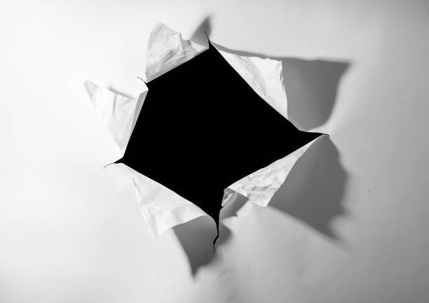 istock Out of the hole in the white wall 1301787870