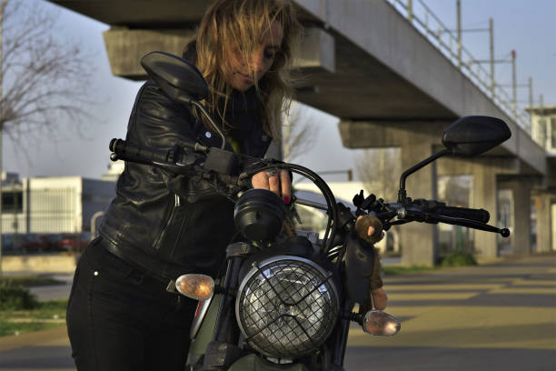 istock WOMAN ON MOTORCYCLE 1301789118