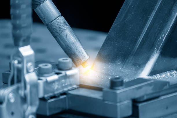The abstract scene of laser welding machine with lighting effect. The hi-technology welding process by robotic system.