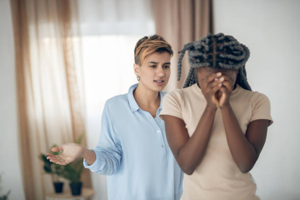 istock Same sex couple having an argument and looking unhappy 1301790110