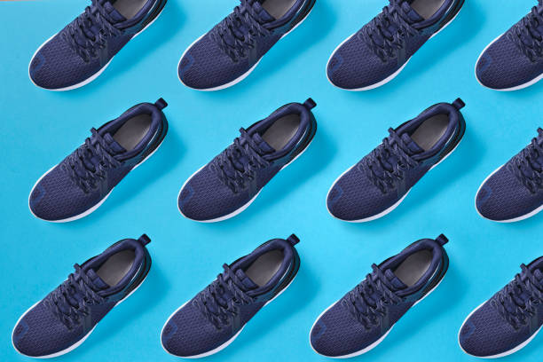 Pattern with image of sports shoes, sport top view, text space. Athlete's set. Flat lay composition. Sports unisex, male and female fitness. Pattern with image of sports shoes, sport top view, text space. Athlete's set. Flat lay composition. Sports unisex, male and female fitness. repetition stock pictures, royalty-free photos & images