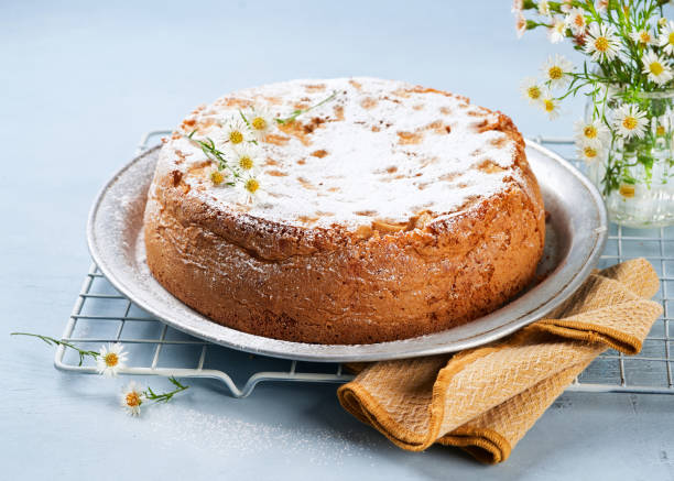 istock Healthy Wholemeal apple cinnamon tea cake on light blue background with copy space. Homemade baked concept. Mother's Day, Birthday Cake card Background. Spring time. 1301793301