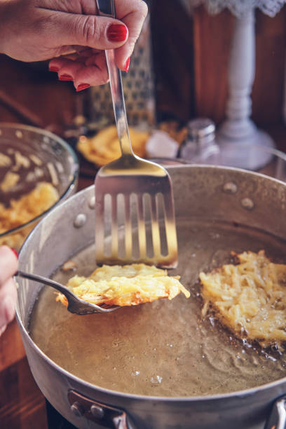 istock Preparing Rosti Potato Pancake in Domestic Kitchen 1301794710