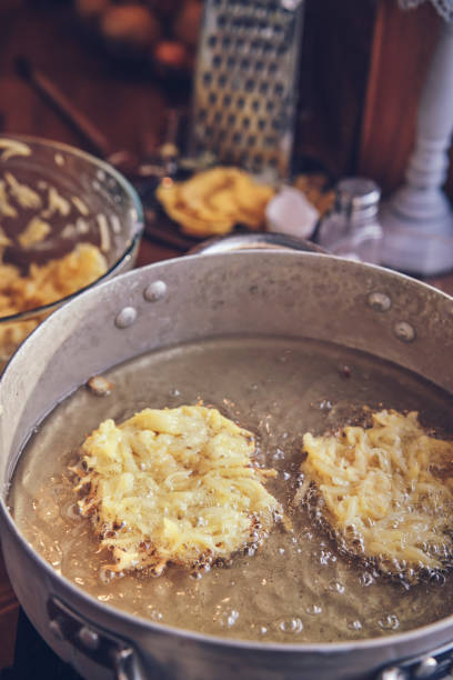 istock Preparing Rosti Potato Pancake in Domestic Kitchen 1301794735