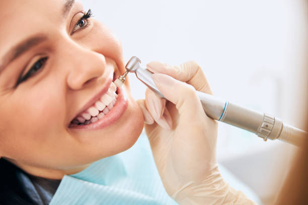 istock Close up of kind woman doing teeth cleaning 1301795749