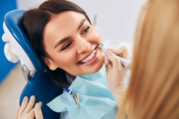 istock Positive delighted patient sitting in dentistry chair 1301795755