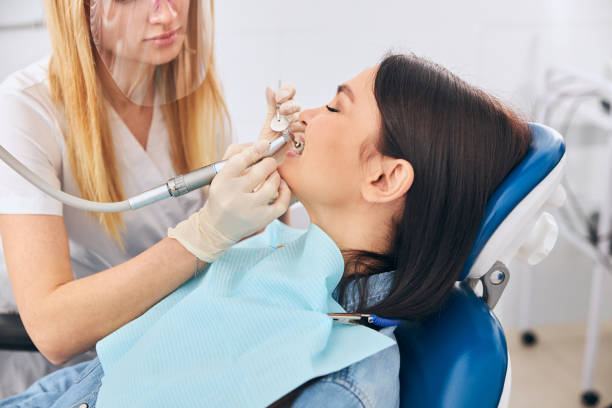 istock Young competent stomatologist doing dental care procedure 1301795771