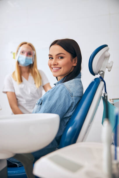Positive delighted patient looking straight at camera stock photo