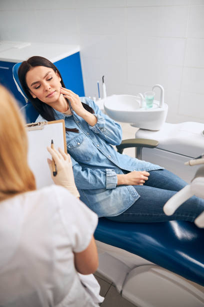 istock Young worried female person suffering sharp toothache 1301795827