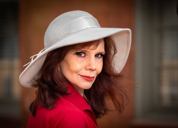 istock Woman in White Floppy Hat 1301795924