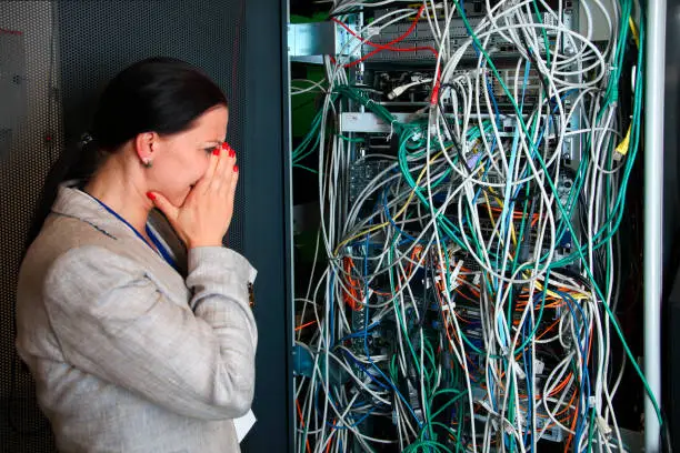 Photo of Female engineer trying to understand network mess