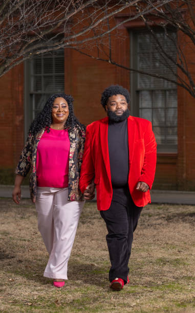 istock African-American Couple Walking Through a Park 1301796592