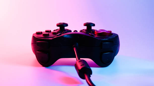 istock game joystick, gamepad. blue red backlight. cyberpunk photo 1301798225
