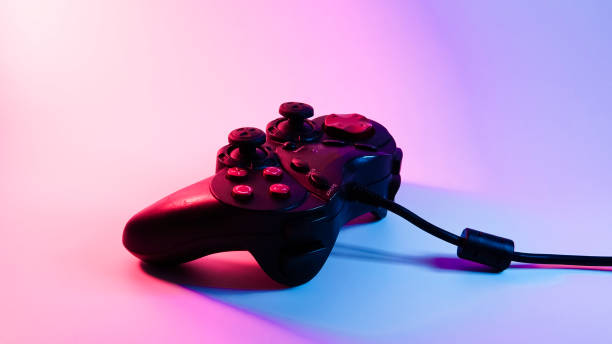 istock game joystick, gamepad. blue red backlight. cyberpunk photo 1301798226