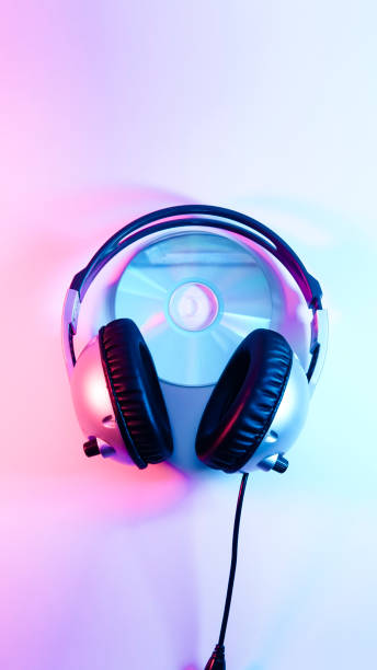 istock headphones and a CD . red and blue illumination, cyberpunk. 1301798758