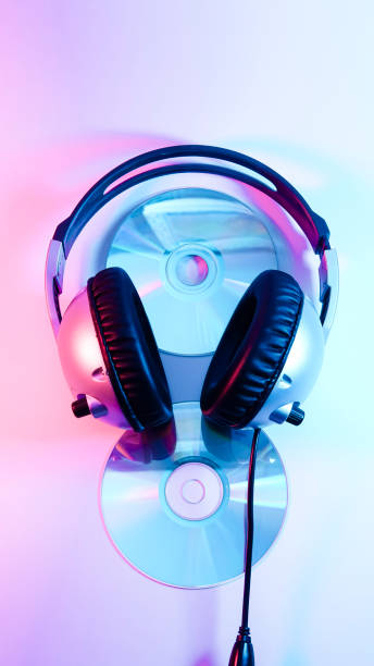 istock headphones and a CD . red and blue illumination, cyberpunk. 1301798774