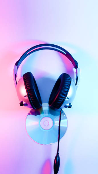 istock headphones and a CD . red and blue illumination, cyberpunk. 1301798809