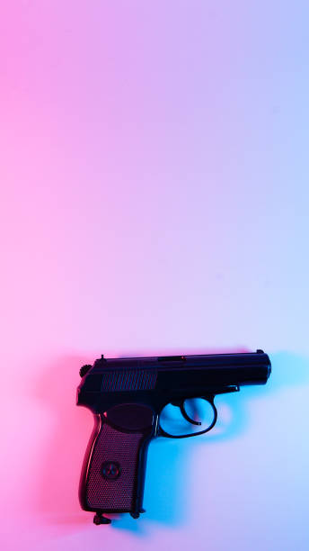 istock makarov pistol . red and blue illumination, cyberpunk. 1301798827
