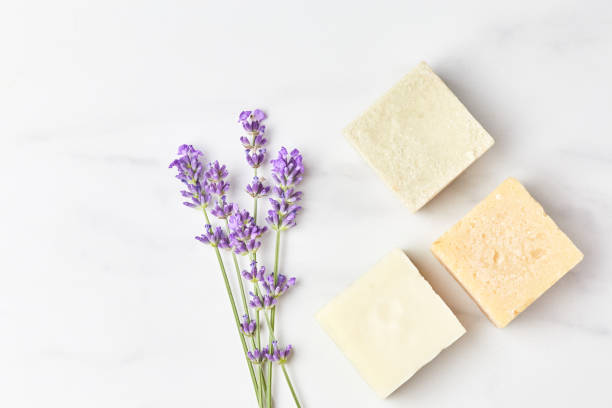 istock handmade soap, mini lavender bouquet on marble background. natural cosmetics concept. top view, flat lay 1301802330