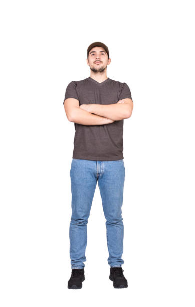 istock Full length confident man employee, keeps arms crossed, looking ahead isolated on white background. Positive male wearing cap and casual apparel 1301802542