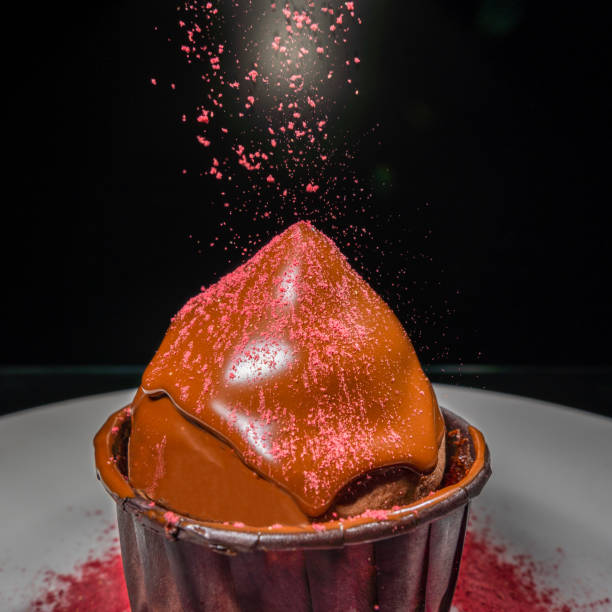 istock cupcake with chocolate cap and pink strawberry sprinkle, close-up, frozen 1301803776