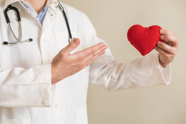 istock Male doctor showing heart shape 1301805273