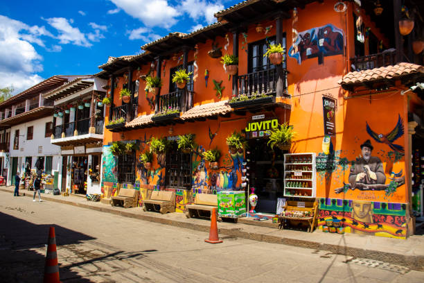 Beautiful streets and houses of the small town of Raquira. The city of pots, Colombia RAQUIRA, COLOMBIA - FEBRUARY 2021. Beautiful streets and houses of the small town of Raquira. The city of pots, Colombia boyacá department photos stock pictures, royalty-free photos & images