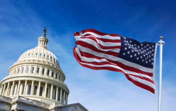 istock American flag waving with the US Capitol Hill 1301806911