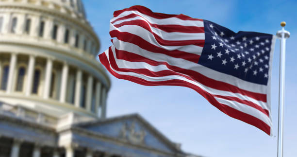 istock American flag waving with the US Capitol Hill 1301806974