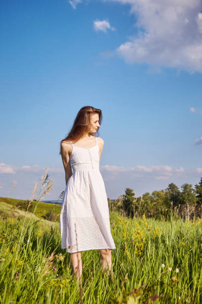 istock girl in the field 1301809635