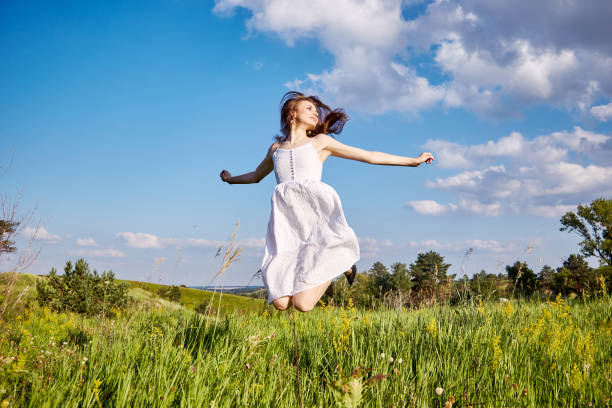 istock girl in the field 1301809810
