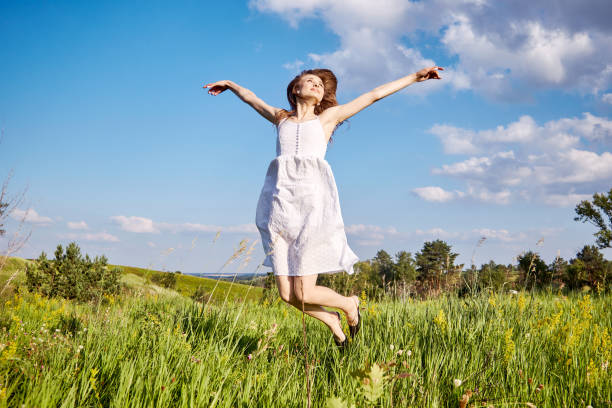 istock girl in the field 1301810510
