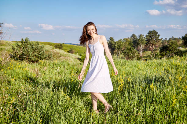 istock girl in the field 1301810540