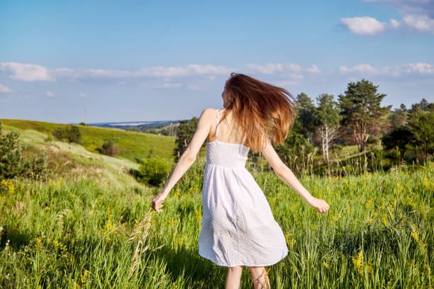 istock girl in the field 1301810574
