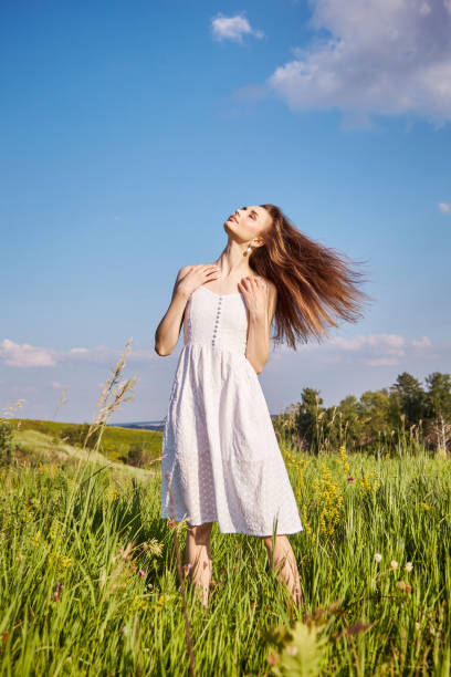 istock girl in the field 1301810718