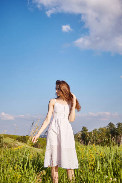istock girl in the field 1301810754