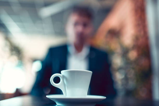 Blur image of playground in the mall with coffee cup, use for background.