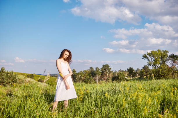istock girl in the field 1301810834