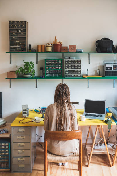istock Back view of unrecognizable women working in workshop 1301811140